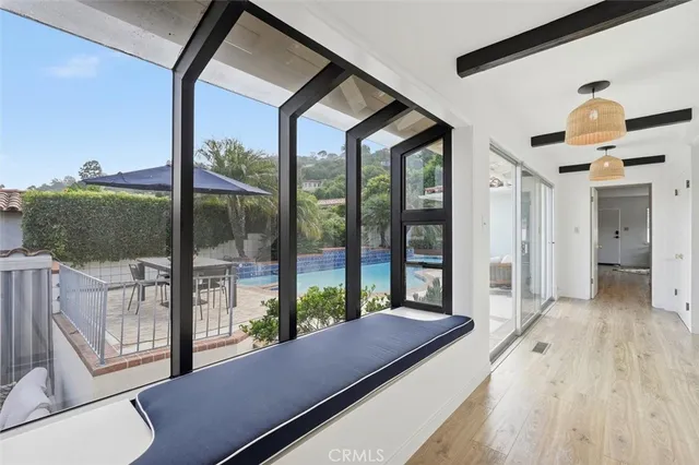 a view of a living room and a balcony