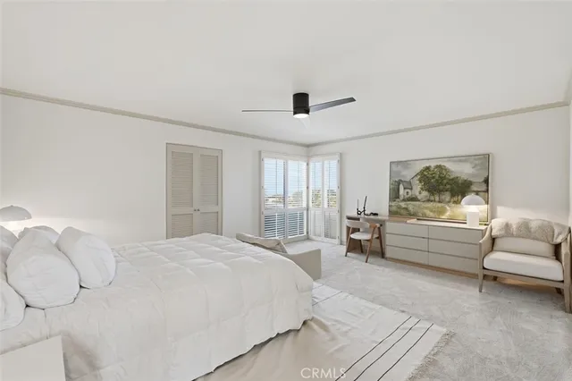 a spacious bedroom with a bed and a couch