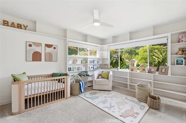 a bedroom with furniture and a window