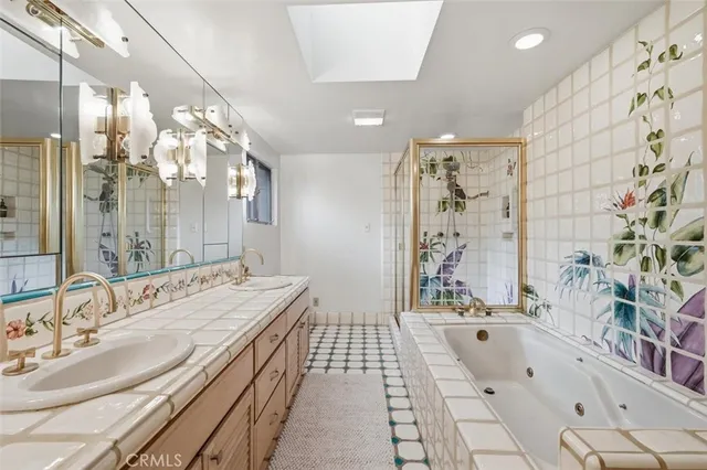 a bathroom with a tub sink and mirror