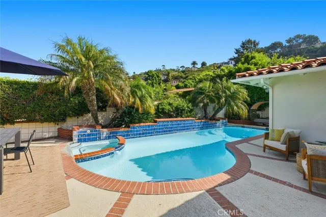 a view of a swimming pool with chairs