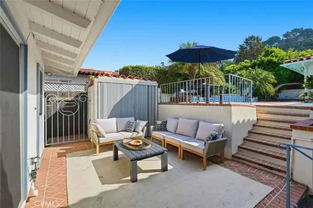 a roof deck view with a seating space