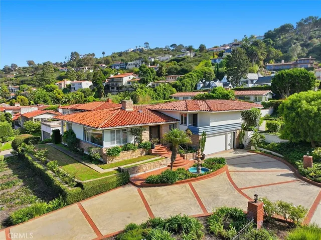 an aerial view of a house with a garden