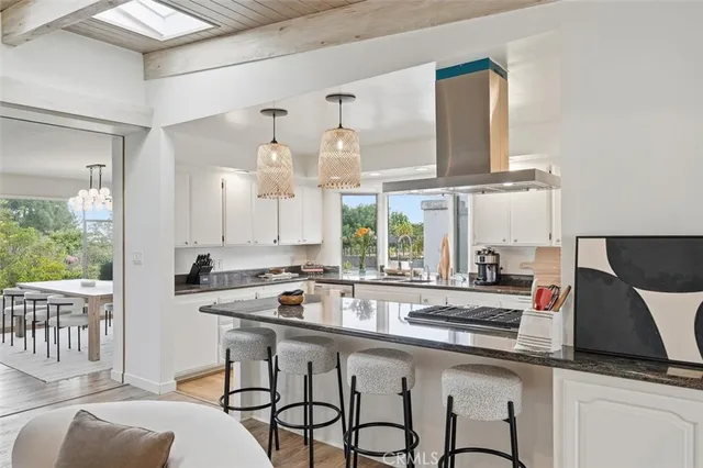 a kitchen with stainless steel appliances a sink and a stove