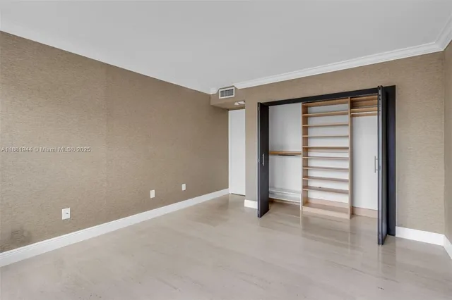 a view of a hallway with wooden shelves