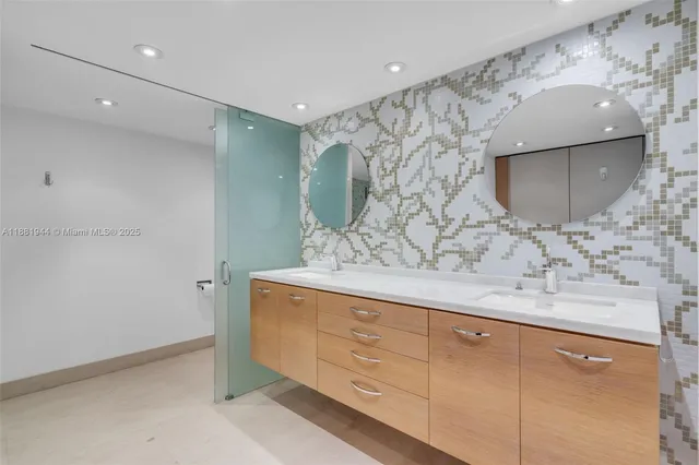 a kitchen with cabinets and stainless steel appliances