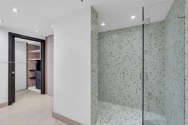 a utility room with cabinets and washer