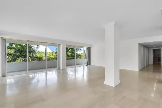 a view of a kitchen with a sink and a refrigerator