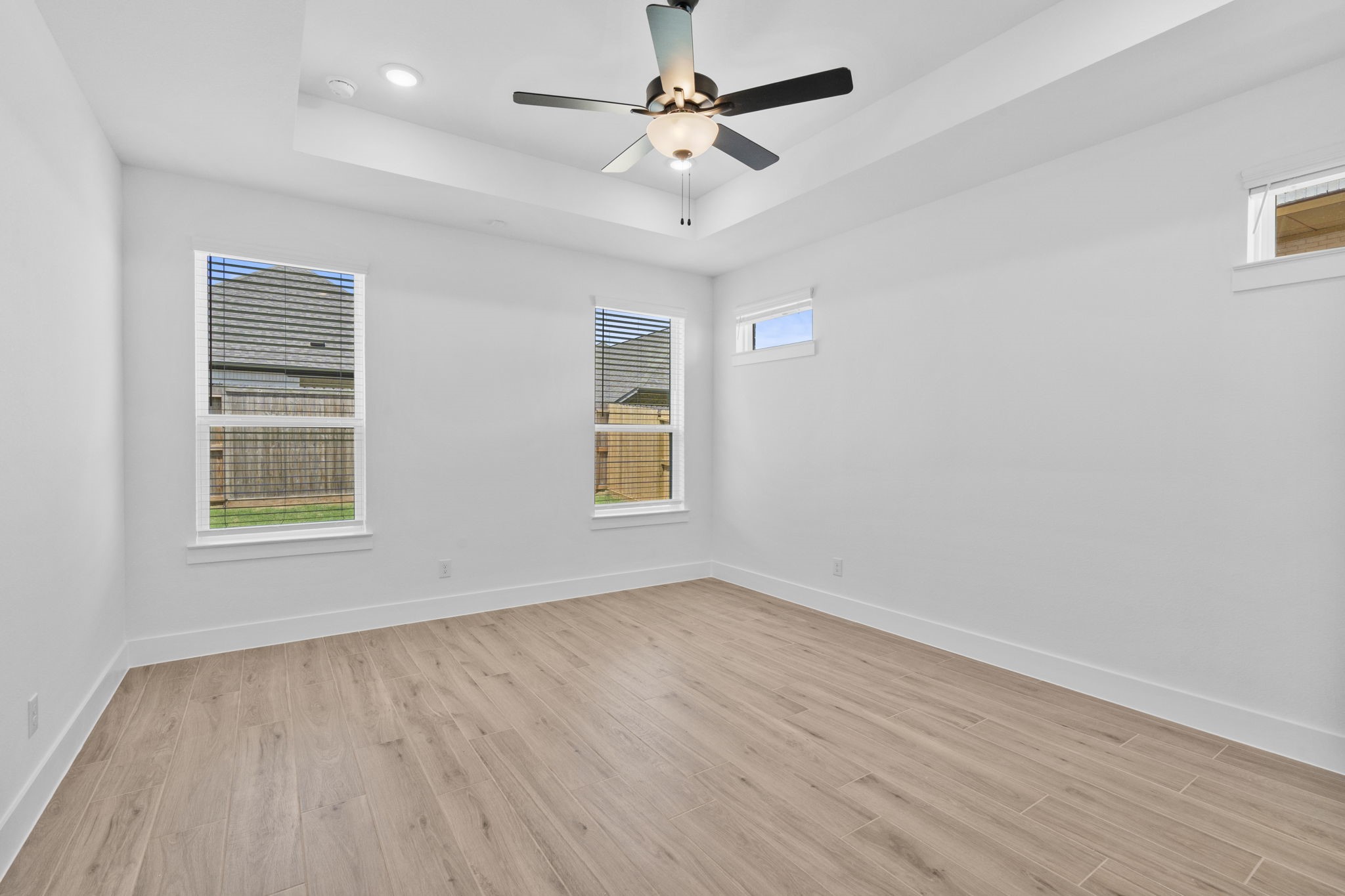 2910 Peach Vly Road Fulshear, TX 77423 - Photo 24 of 35 wooden floor in an empty room with a window