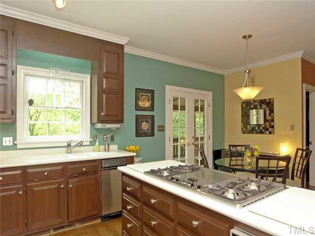 2520 Beechridge Road Raleigh, NC 27608 - Photo 8 of 25 Gas cooktop range and solid surface counters. Kitchen