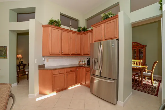 a living room with furniture a couch and a potted plant