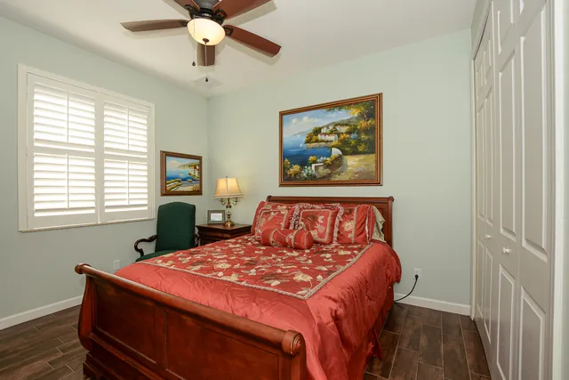 a view of a porch with furniture and a yard
