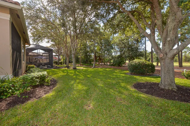 a room with furniture pool table and windows