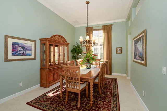 a living room with furniture a window and a flat screen tv