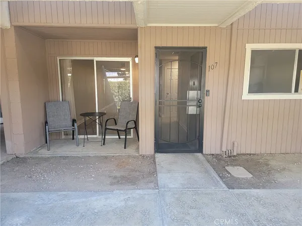 a view of a livingroom with furniture and front door