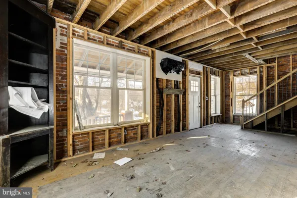 a view of an empty room with a fireplace