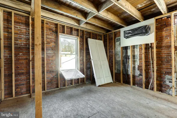 a view of an empty room with a balcony