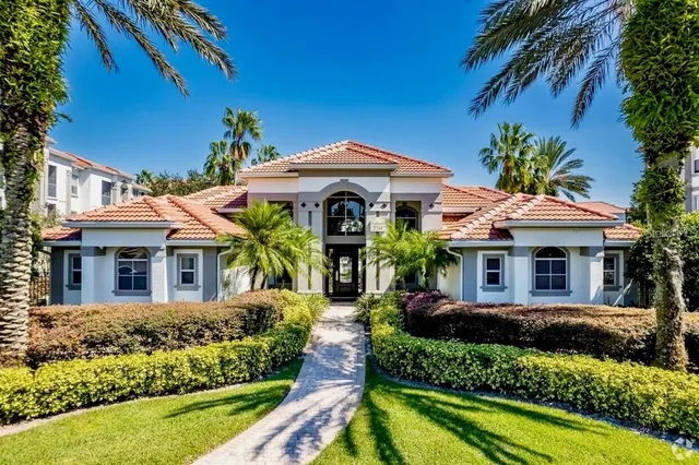 a front view of a house with garden