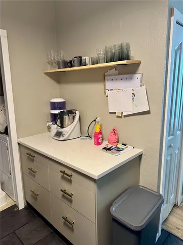 a utility room with sink dryer and washer