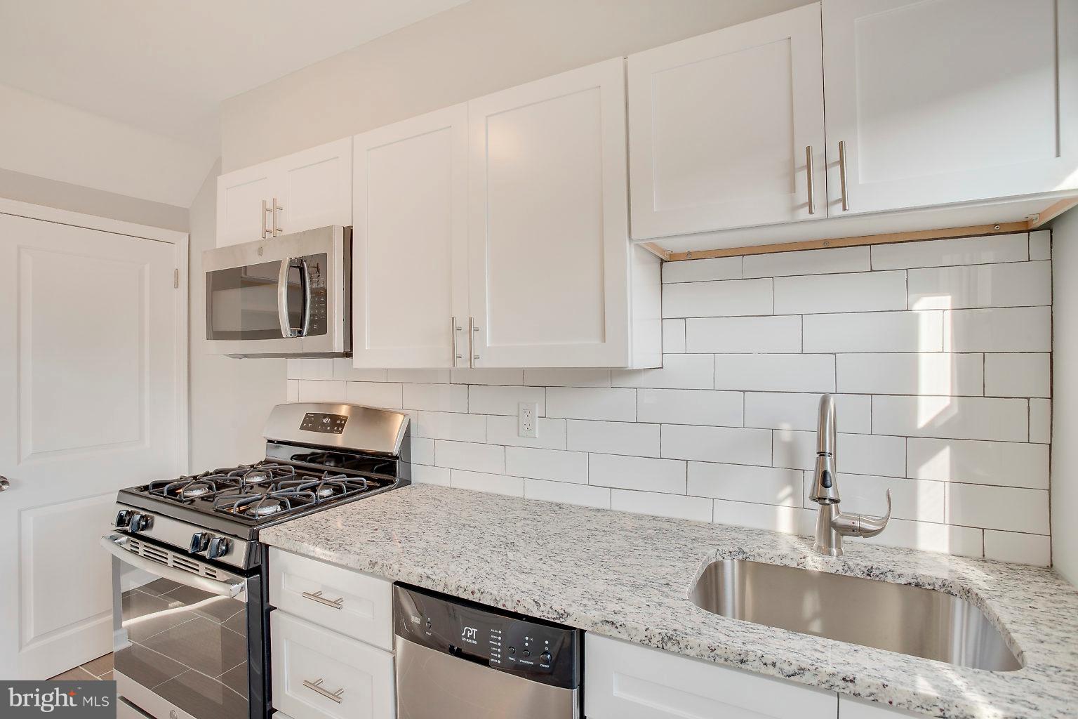 2156 Coralthorn Road Baltimore, MD 21220 - Photo 21 of 37 Granite counters with inset SS sink