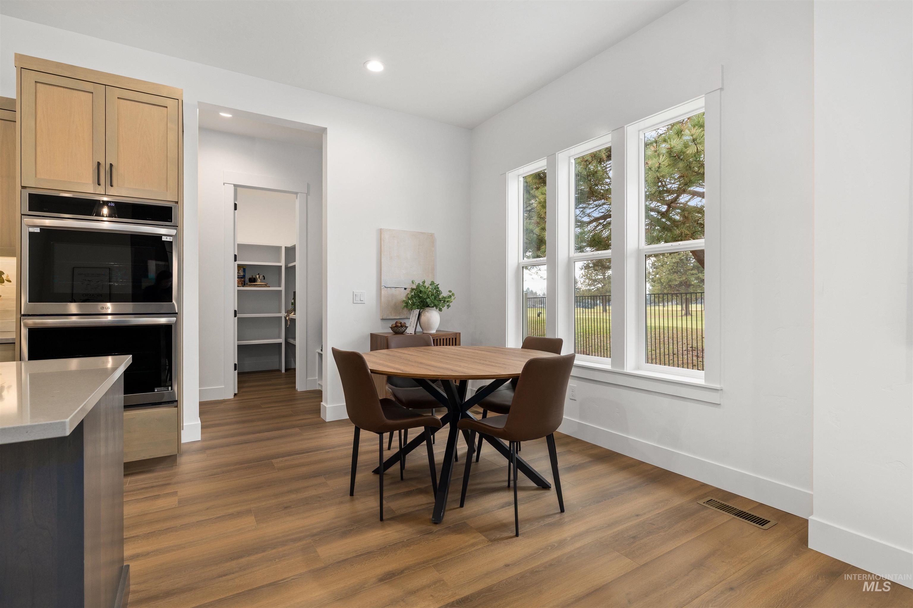 611 North Hiltonhead Way Eagle, ID 83616 - Photo 16 of 38 Dining room with dark wood-style flooring and recessed lighting