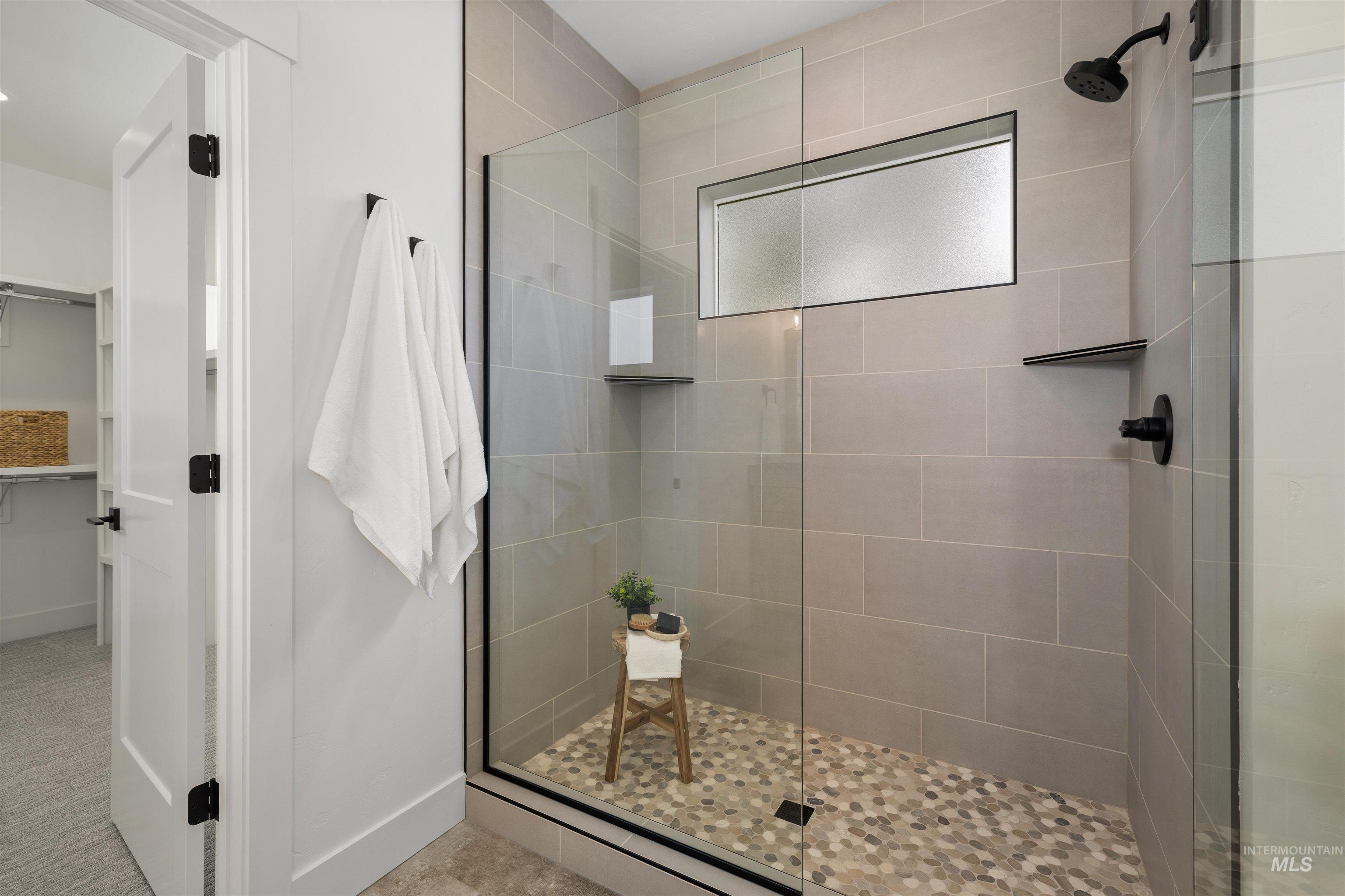 611 North Hiltonhead Way Eagle, ID 83616 - Photo 27 of 37 Bathroom with a stall shower and a spacious closet. Photo Similar.