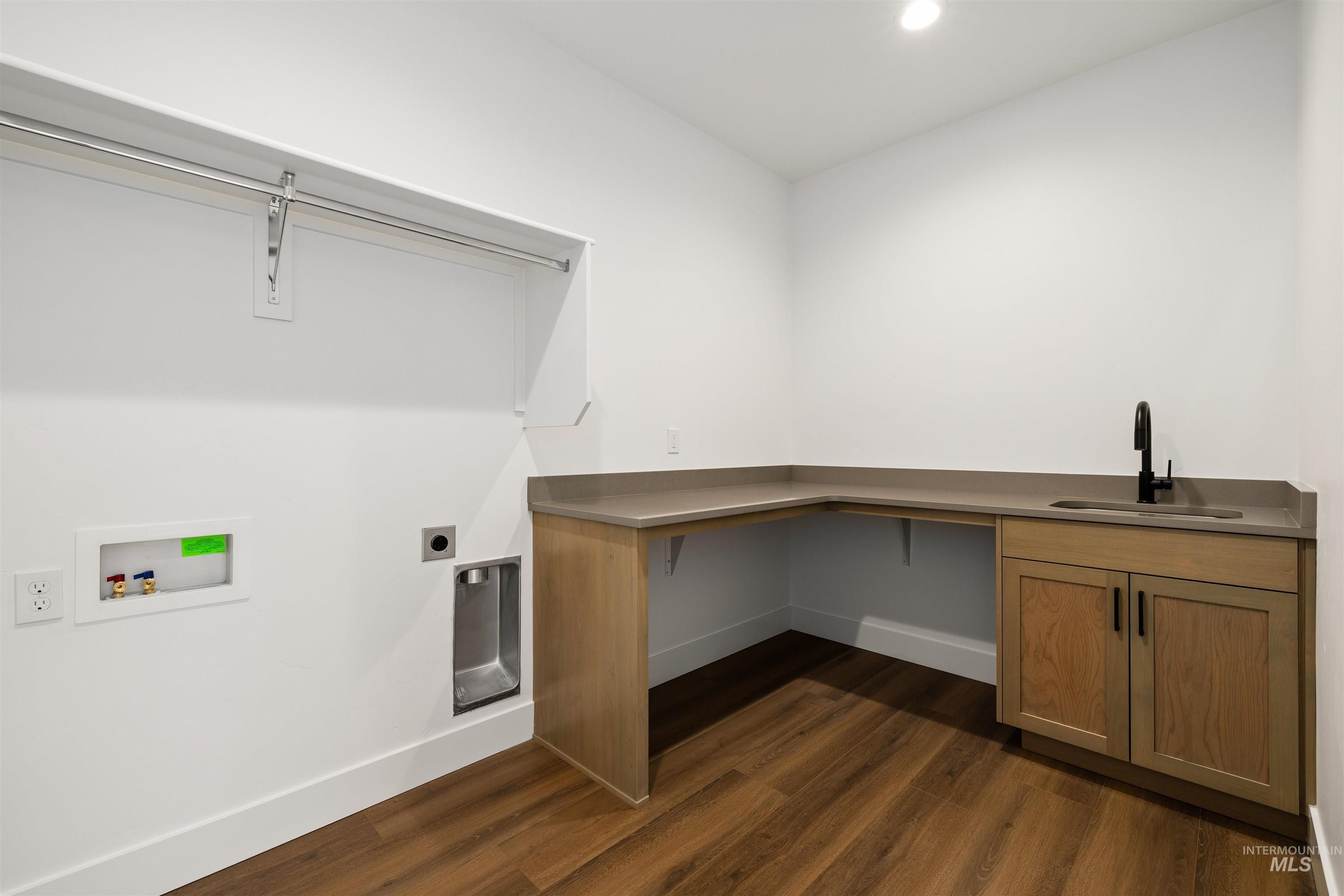 611 North Hiltonhead Way Eagle, ID 83616 - Photo 33 of 38 Laundry room with dark wood-type flooring, hookup for an electric dryer, hookup for a washing machine, recessed lighting, and cabinet space