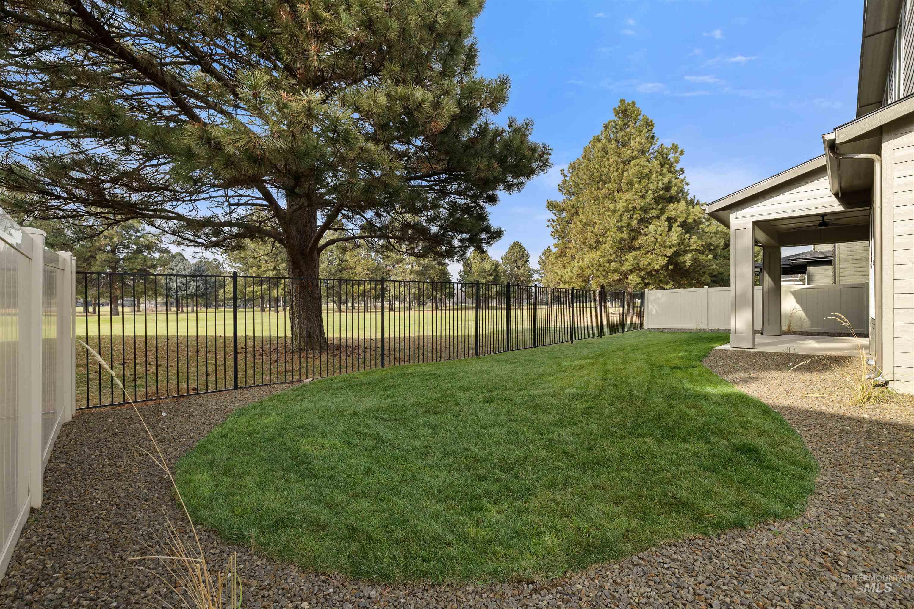 611 North Hiltonhead Way Eagle, ID 83616 - Photo 33 of 37 Fenced backyard with a patio area. Photo Similar.