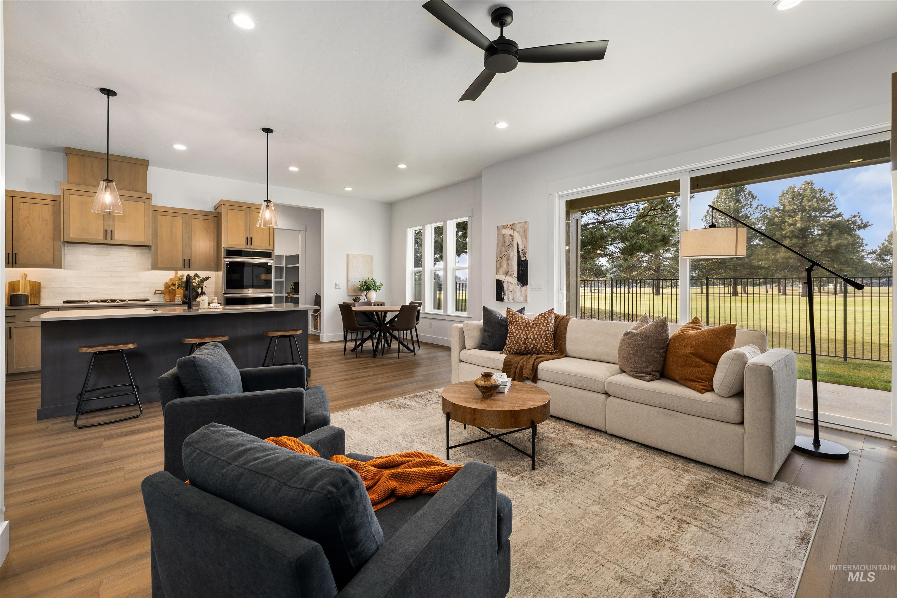 611 North Hiltonhead Way Eagle, ID 83616 - Photo 9 of 38 Living room featuring light wood finished floors, recessed lighting, and ceiling fan