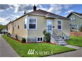 501 Wells Avenue North Renton, WA 98057 - Photo 1 of 1 a front view of a house with garden
