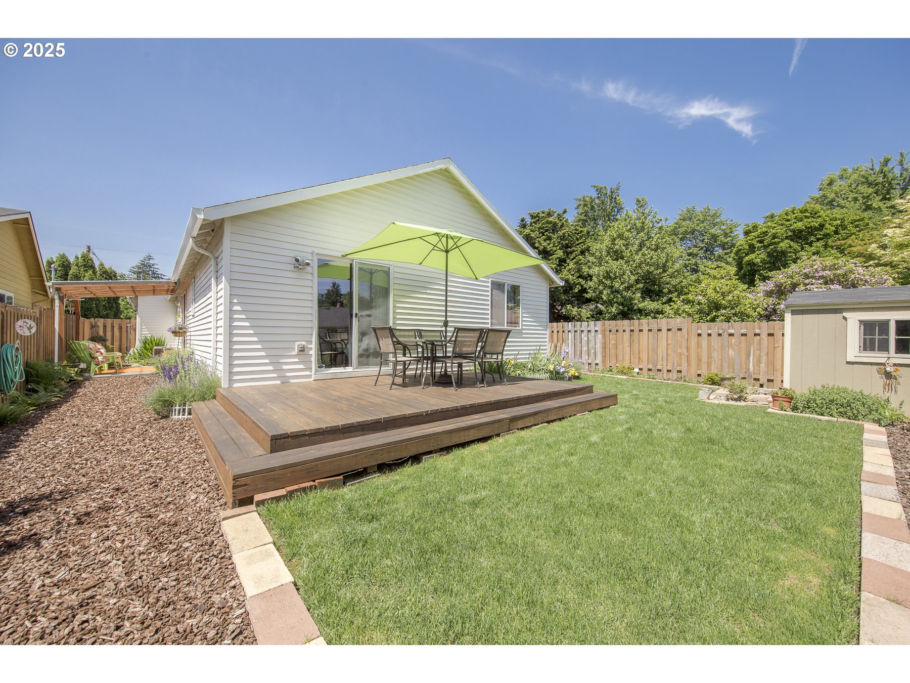 212 Northeast 148th Avenue Portland, OR 97230 - Photo 19 of 23 a view of a house with a backyard and a patio