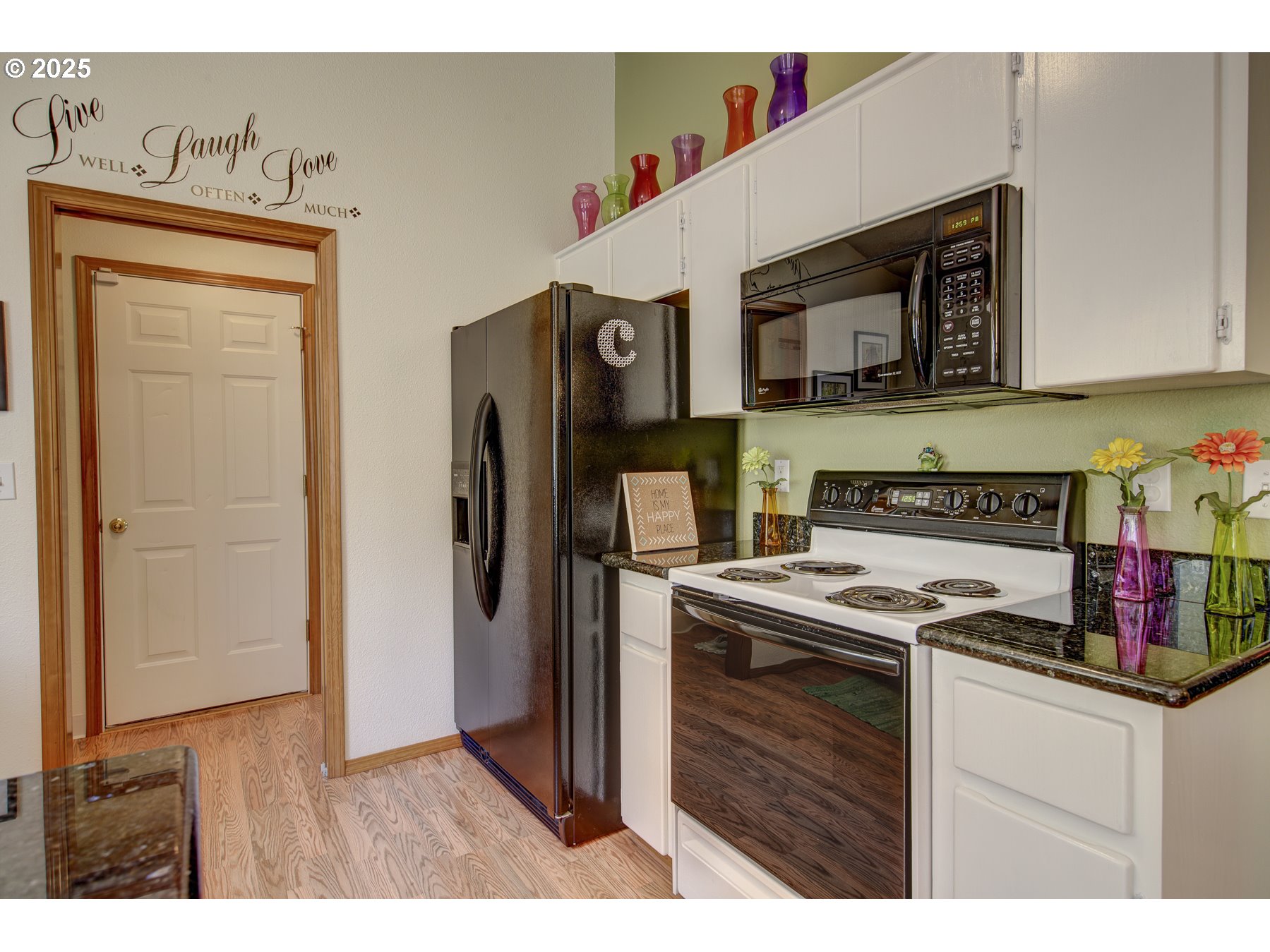 212 Northeast 148th Avenue Portland, OR 97230 - Photo 8 of 23 a kitchen with stainless steel appliances granite countertop a refrigerator and a stove