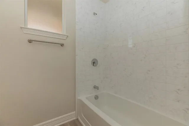 a room with gym equipment and windows