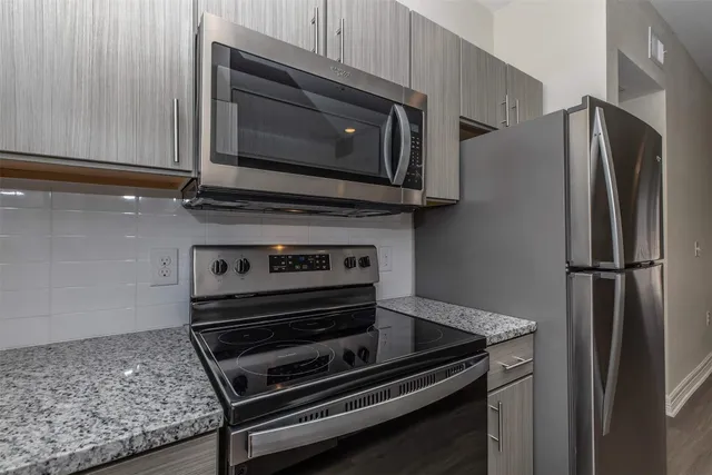 a kitchen with a stove and a microwave