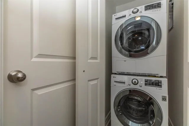 a view of a storage & utility room with dryer and washer