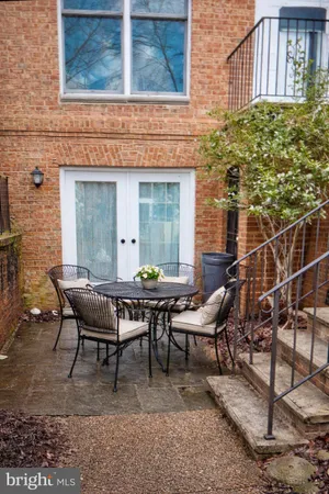 a backyard of a house with outdoor seating