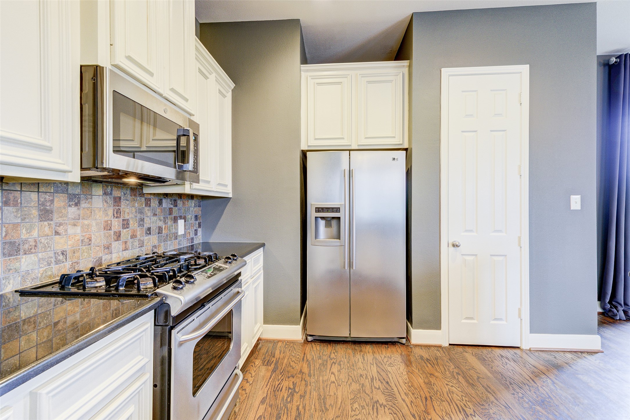 3129 Dallas Street Houston, TX 77003 - Photo 12 of 24 a kitchen with granite countertop a refrigerator a sink and a stove