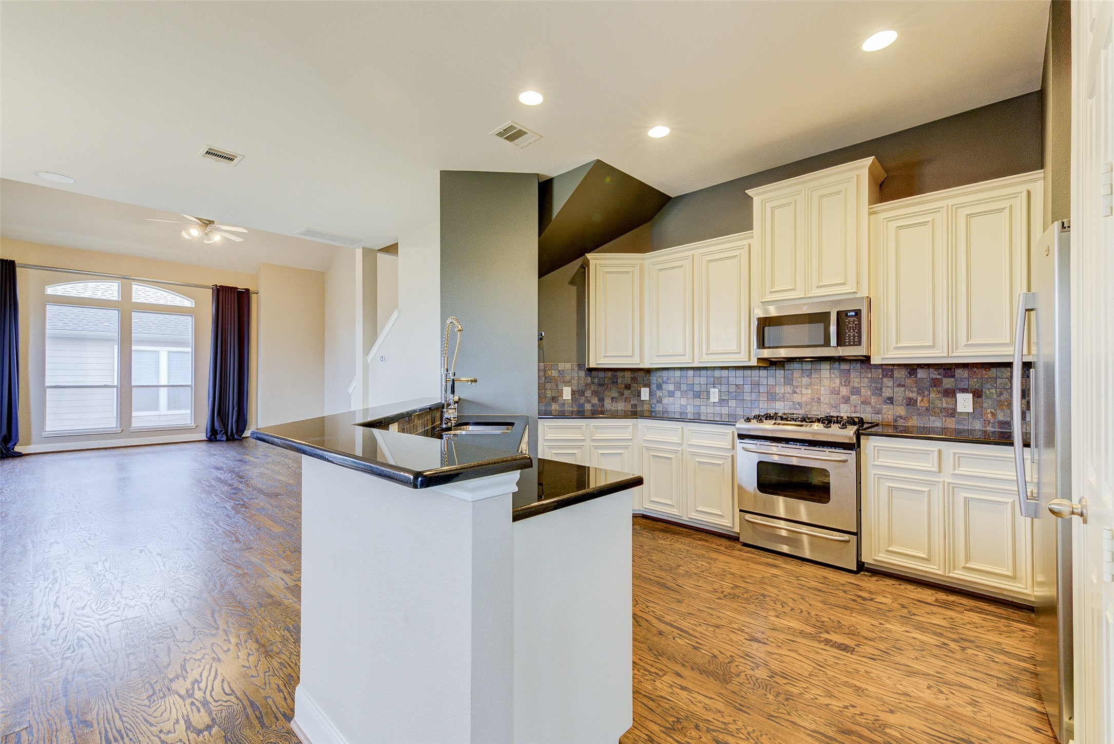 3129 Dallas Street Houston, TX 77003 - Photo 14 of 24 a kitchen with granite countertop a stove and a sink