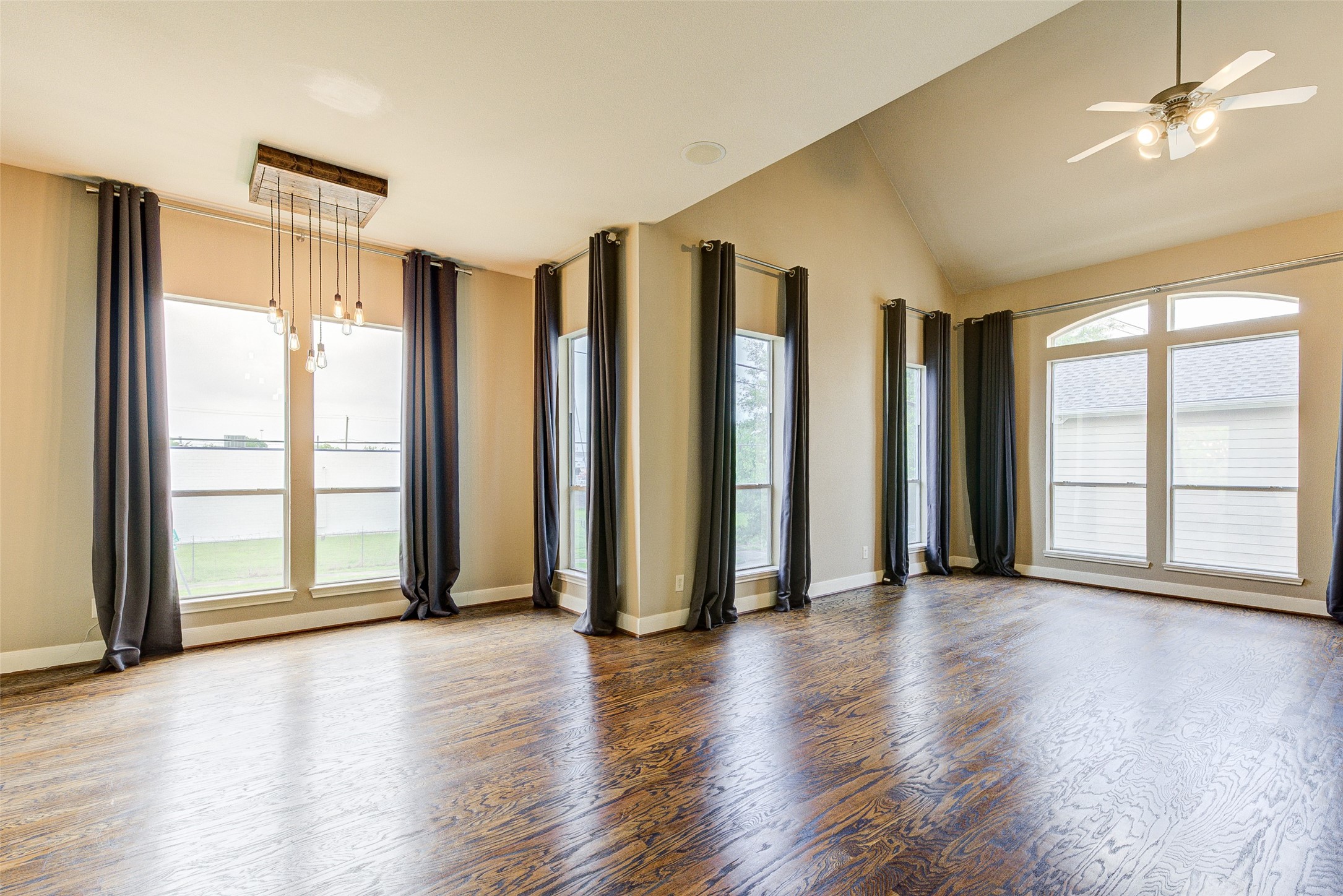 3129 Dallas Street Houston, TX 77003 - Photo 16 of 24 an empty room with wooden floor and windows