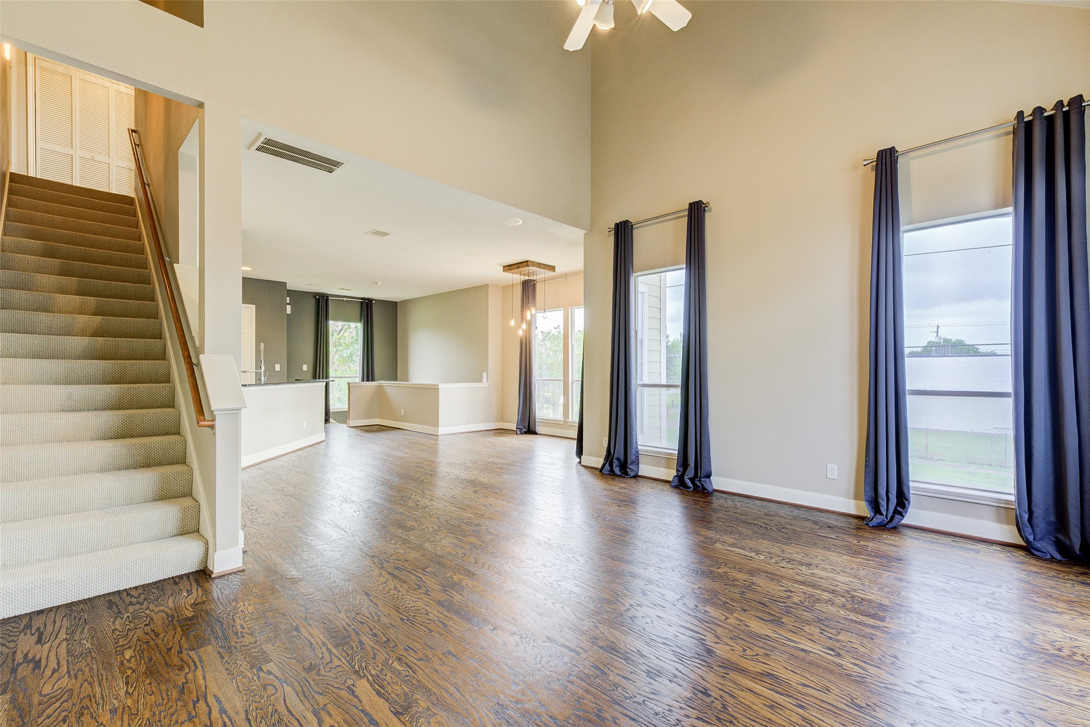 3129 Dallas Street Houston, TX 77003 - Photo 18 of 24 a view of a hallway with wooden floor and staircase