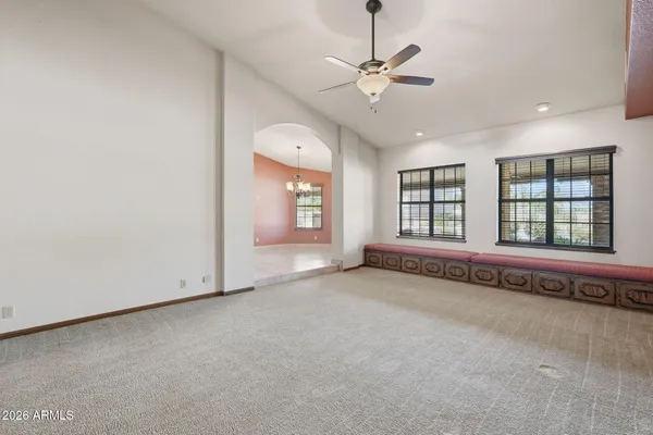 a kitchen with stainless steel appliances granite countertop a table and chairs