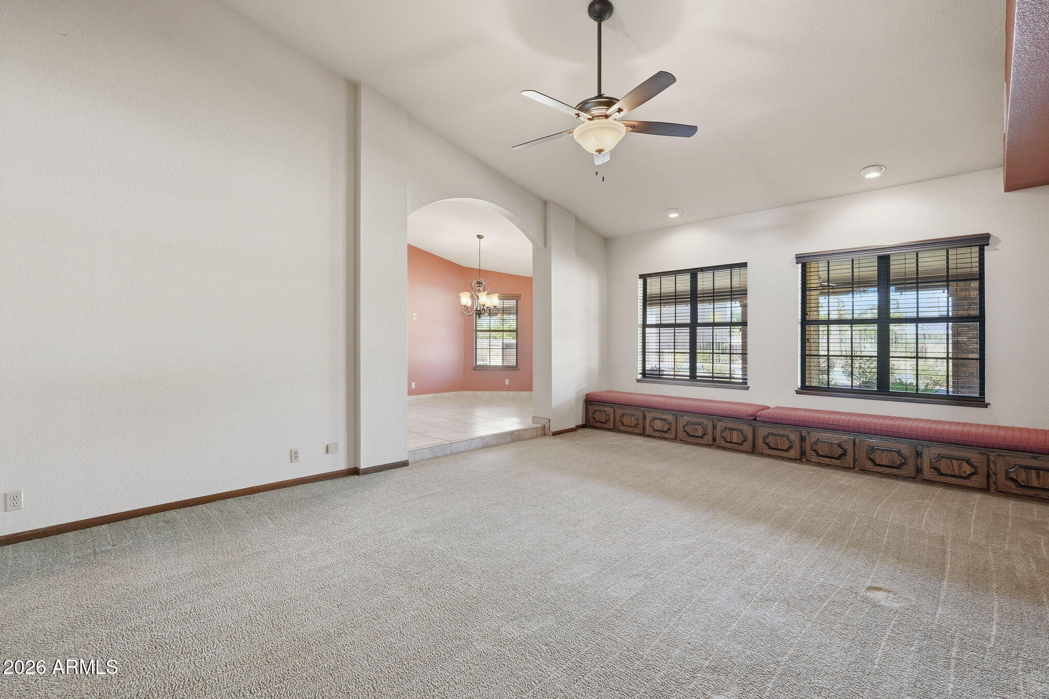 602 East Carver Road Tempe, AZ 85284 - Photo 10 of 85 an empty room with chandelier fan and windows