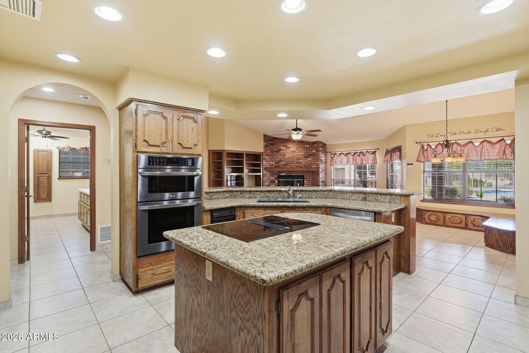 602 East Carver Road Tempe, AZ 85284 - Photo 19 of 85 a kitchen with stainless steel appliances granite countertop a table and chairs