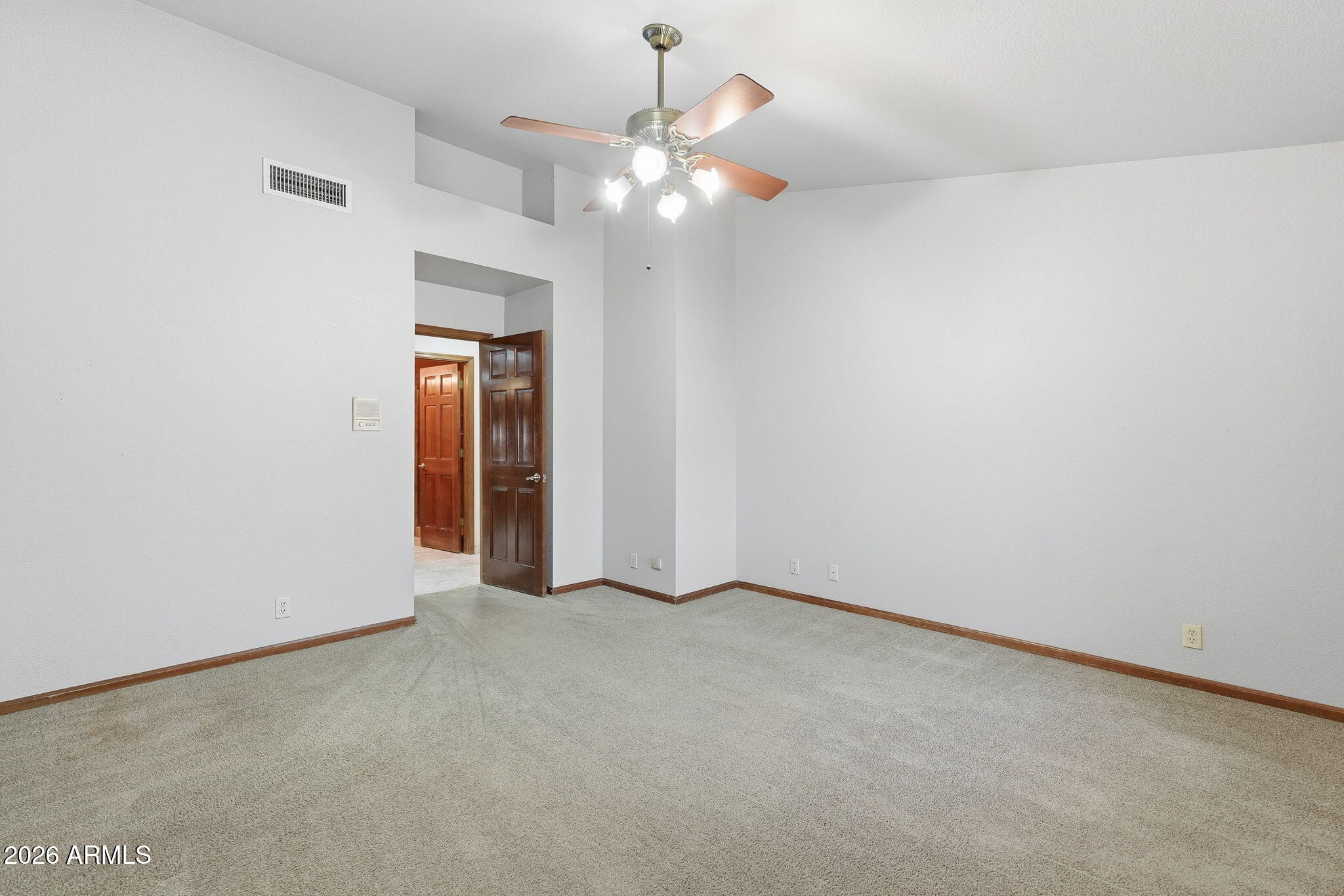 602 East Carver Road Tempe, AZ 85284 - Photo 25 of 85 an empty room with a fan and a chandelier fan