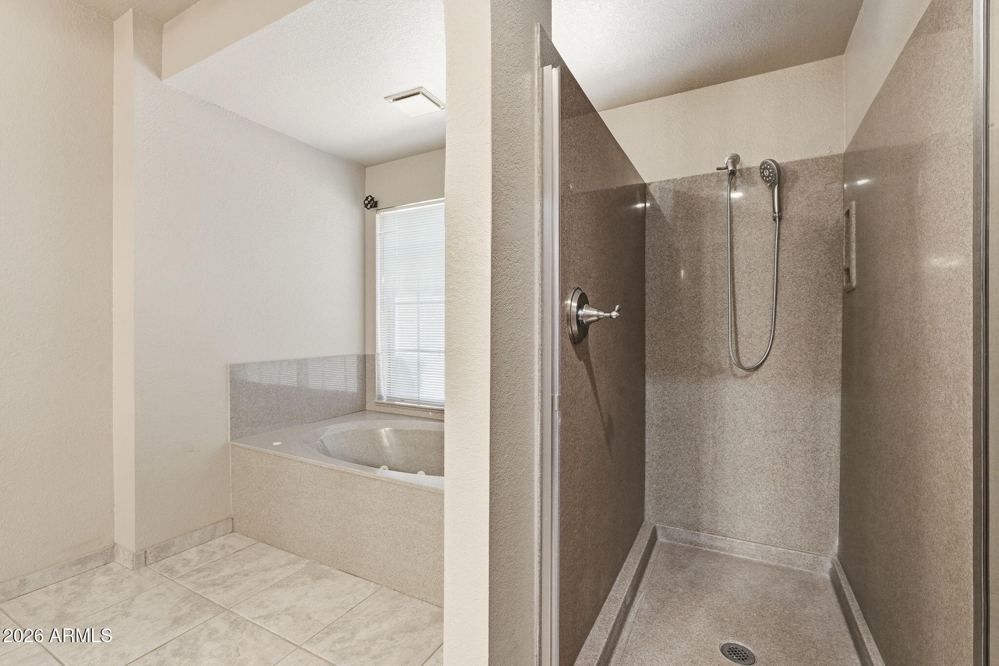 602 East Carver Road Tempe, AZ 85284 - Photo 32 of 85 a bathroom with a granite countertop bathtub shower and toilet