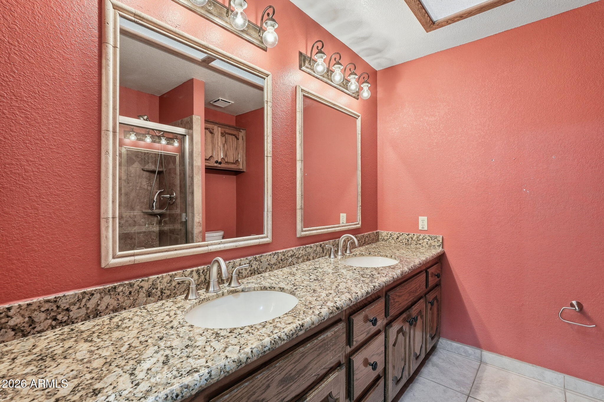602 East Carver Road Tempe, AZ 85284 - Photo 35 of 85 a bathroom with a granite countertop sink and a mirror