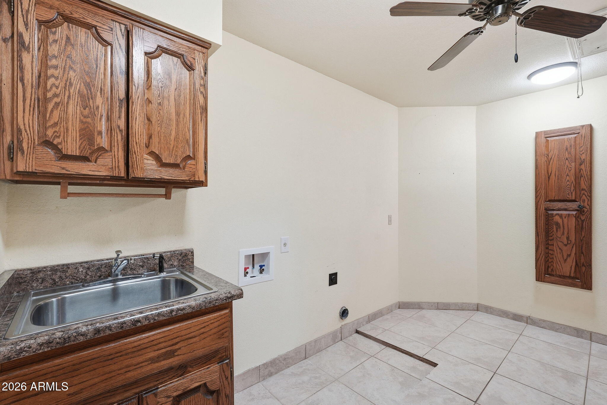 602 East Carver Road Tempe, AZ 85284 - Photo 40 of 85 a bathroom with a sink and washing machine