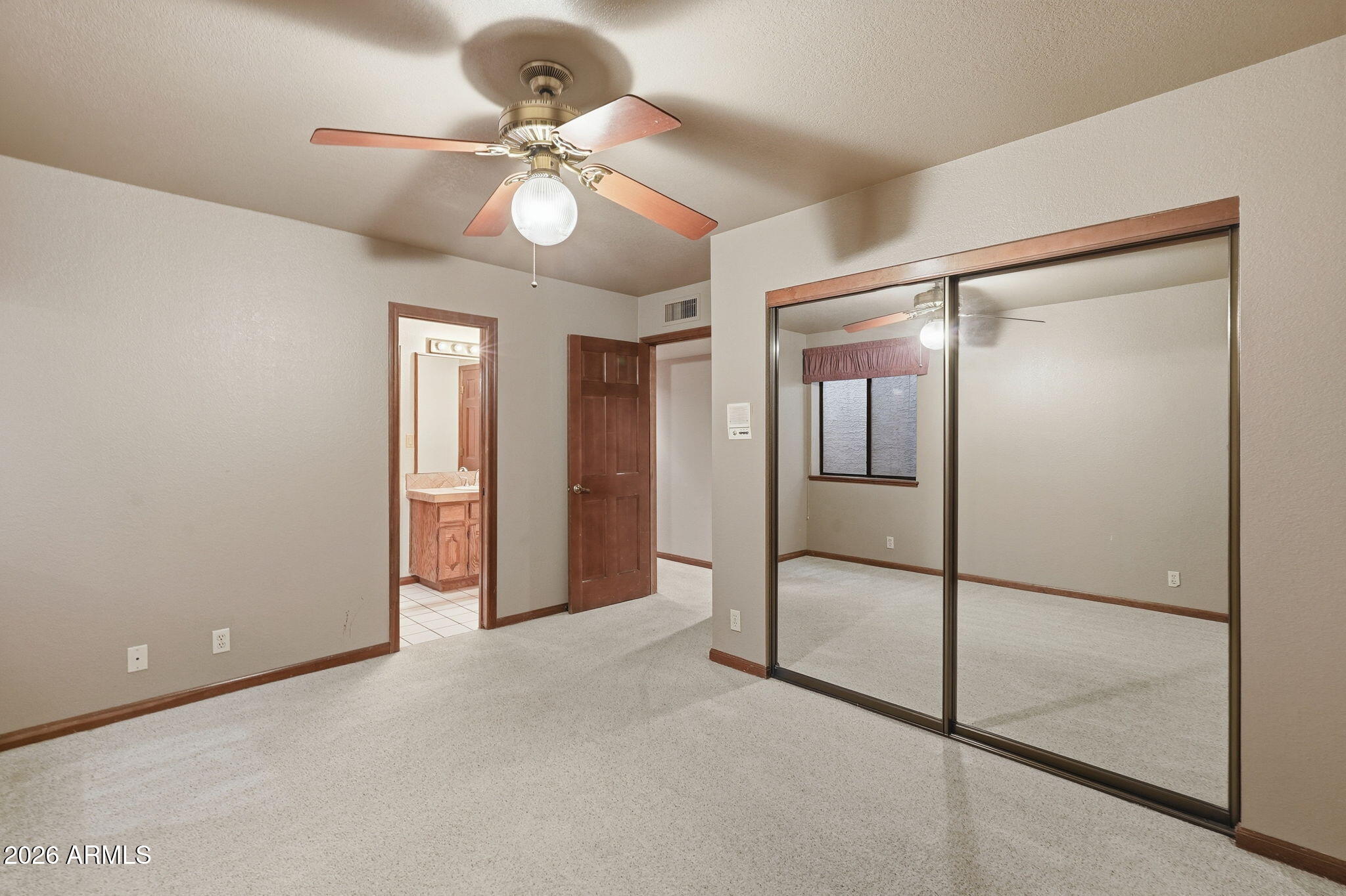 602 East Carver Road Tempe, AZ 85284 - Photo 45 of 85 a view of an empty room with a fan