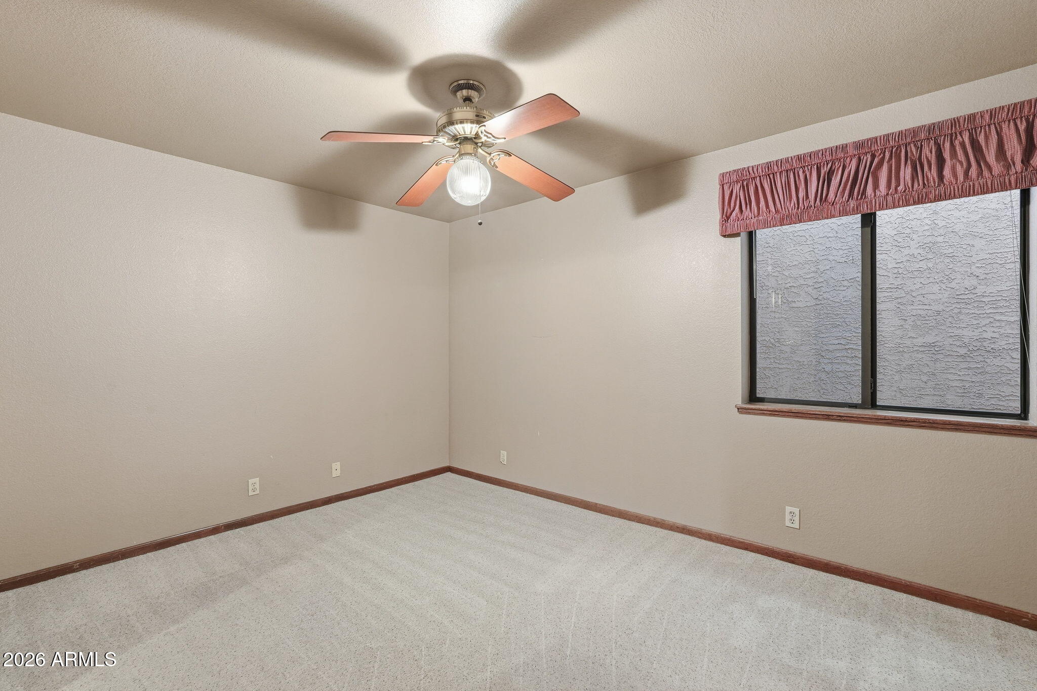 602 East Carver Road Tempe, AZ 85284 - Photo 46 of 85 an empty room with a window and a fan