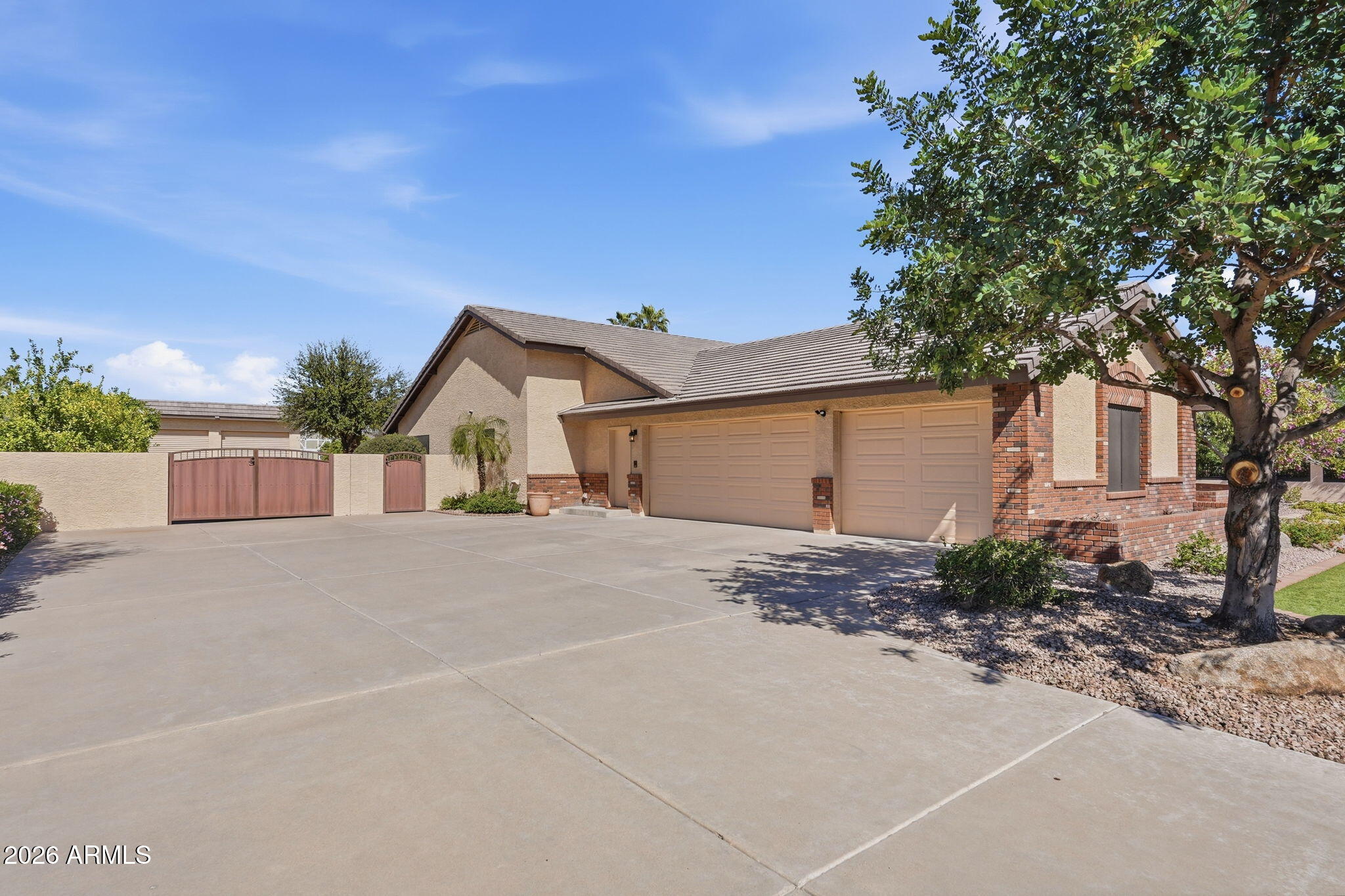 602 East Carver Road Tempe, AZ 85284 - Photo 4 of 85 a view of a house with a yard and garage